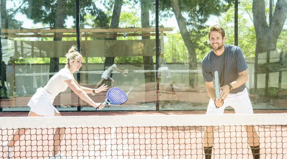 Couple playing tennis